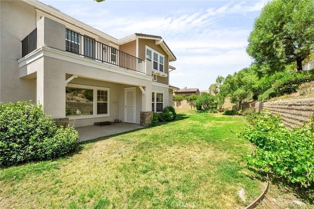 13812 Breeders Cup Dr, Rancho Cucamonga, CA 91739 - rear view of property with a balcony, stucco siding, and a patio area
