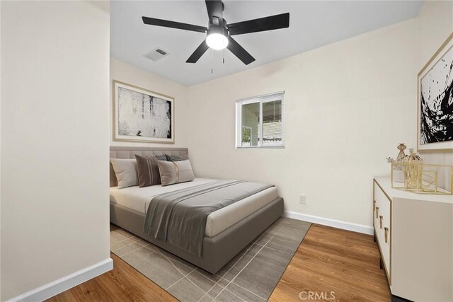 326 Water St, Bakersfield, CA 93305 - bedroom with wood finished floors and a ceiling fan