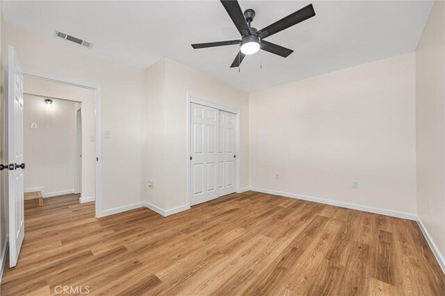 326 Water St, Bakersfield, CA 93305 - unfurnished bedroom with light wood-style flooring, a closet, and a ceiling fan