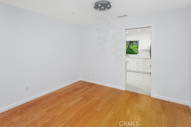 22570 Napa St, West Hills, CA 91304 - empty room featuring light wood-type flooring and baseboards