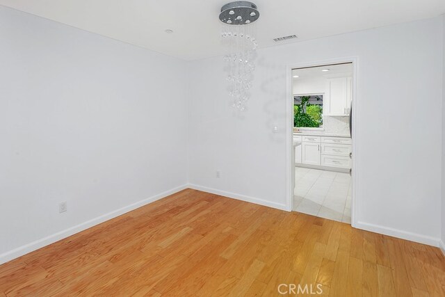 22570 Napa St, West Hills, CA 91304 - empty room featuring light wood-type flooring and baseboards