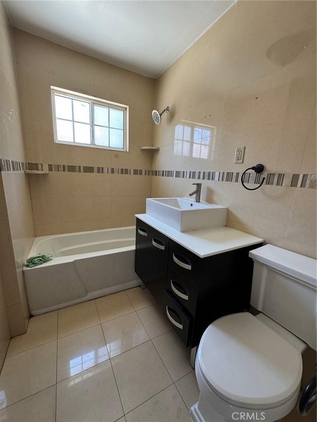 1442 E 76th Pl, Los Angeles, CA 90001 - full bathroom featuring tile walls, vanity, washtub / shower combination, and tile patterned flooring