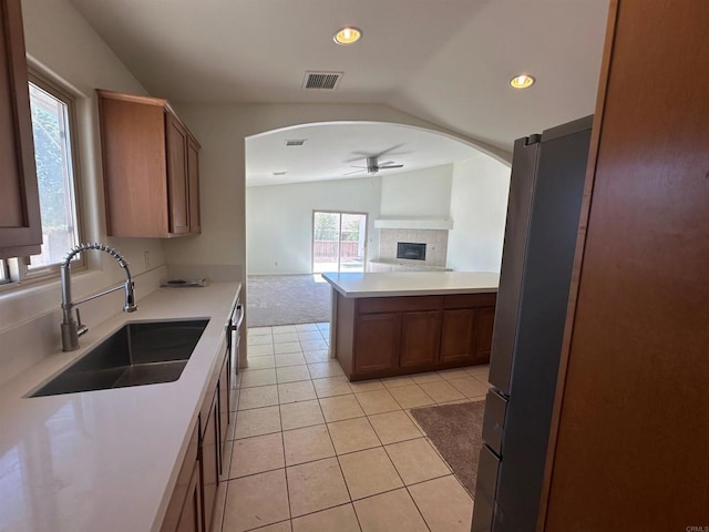 31100 Desert Palm Dr, Thousand Palms, CA 92276 - kitchen with lofted ceiling, ceiling fan, arched walkways, open floor plan, and recessed lighting