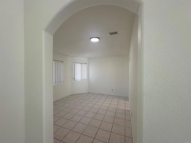 31100 Desert Palm Dr, Thousand Palms, CA 92276 - spare room featuring light tile patterned floors and arched walkways