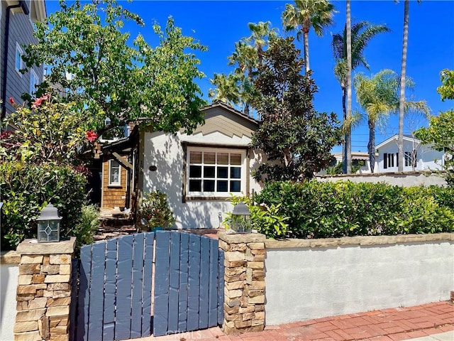 135 Turquoise Ave, Newport Beach, CA 92662 - view of front of house with a gate and stucco siding