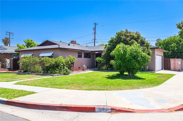 1002 N Iroquois Ave, Anaheim, CA 92801 - single story home featuring a front yard, stucco siding, and an attached garage