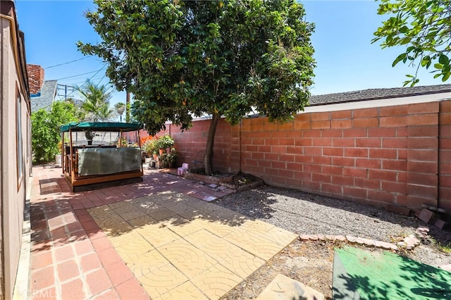1002 N Iroquois Ave, Anaheim, CA 92801 - fenced backyard with a patio area