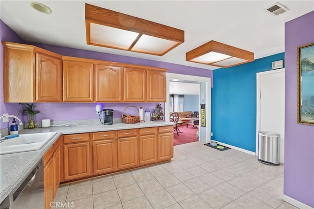 1002 N Iroquois Ave, Anaheim, CA 92801 - kitchen with stainless steel dishwasher and light countertops