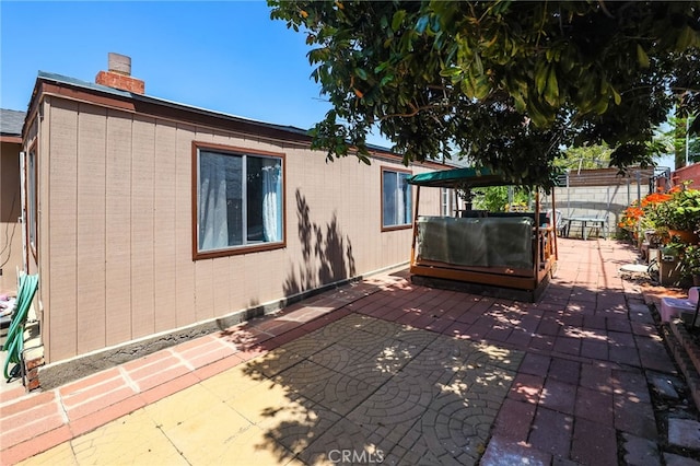 1002 N Iroquois Ave, Anaheim, CA 92801 - view of side of property featuring a patio and a chimney