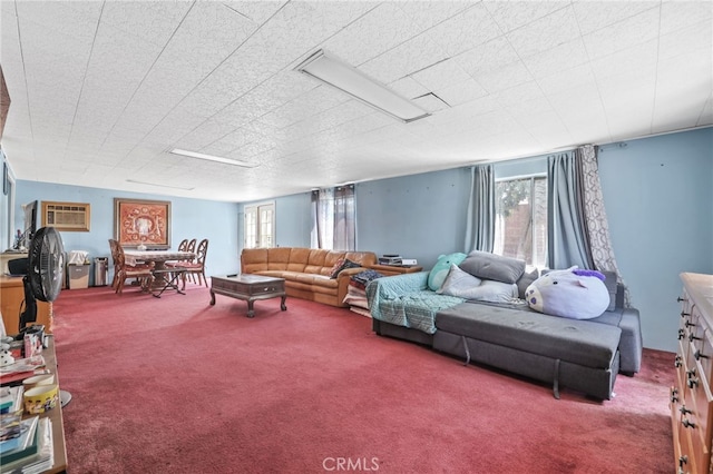 1002 N Iroquois Ave, Anaheim, CA 92801 - living area with carpet and a wall mounted AC