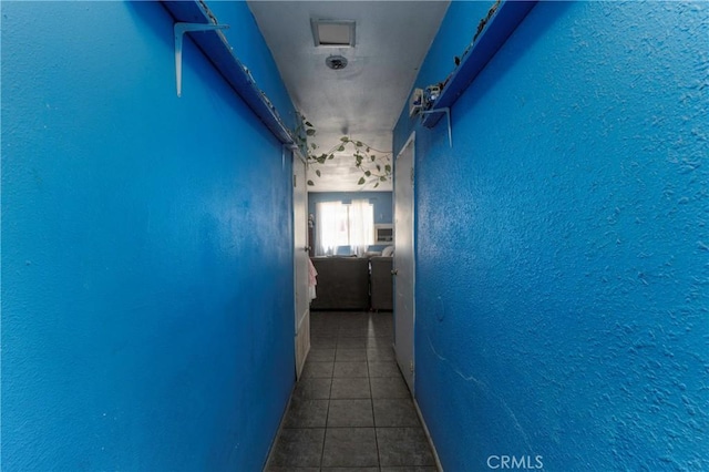 4760 Crest Ave, Riverside, CA 92503 - hall featuring tile patterned flooring and a textured wall