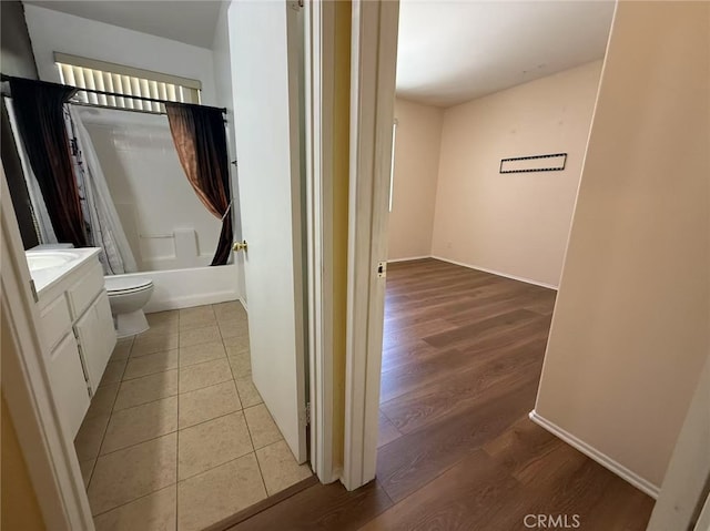 12673 Field Way, Victorville, CA 92395 - bathroom with vanity, shower / bath combo with shower curtain, and wood finished floors