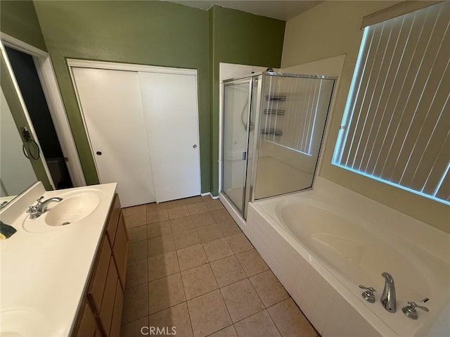 12673 Field Way, Victorville, CA 92395 - bathroom featuring vanity, a bath, tile patterned floors, and a stall shower