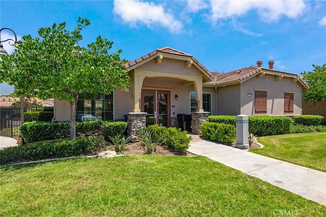 13246 Baxter Springs Dr, Rancho Cucamonga, CA 91739 - view of front facade with a tiled roof, french doors, and stucco siding