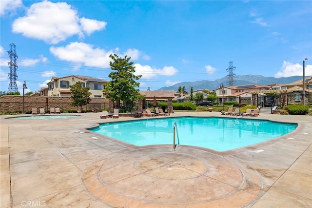 13246 Baxter Springs Dr, Rancho Cucamonga, CA 91739 - community pool with a mountain view and a patio area