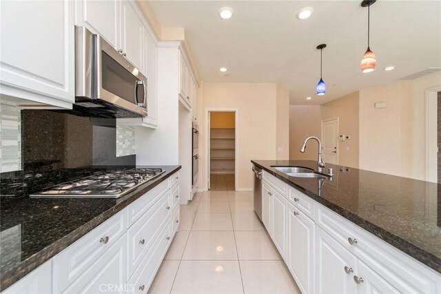 13246 Baxter Springs Dr, Rancho Cucamonga, CA 91739 - kitchen with stainless steel appliances, backsplash, white cabinets, pendant lighting, and recessed lighting