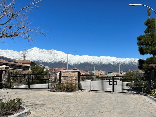 13246 Baxter Springs Dr, Rancho Cucamonga, CA 91739 - view of patio featuring a gate and a mountain view