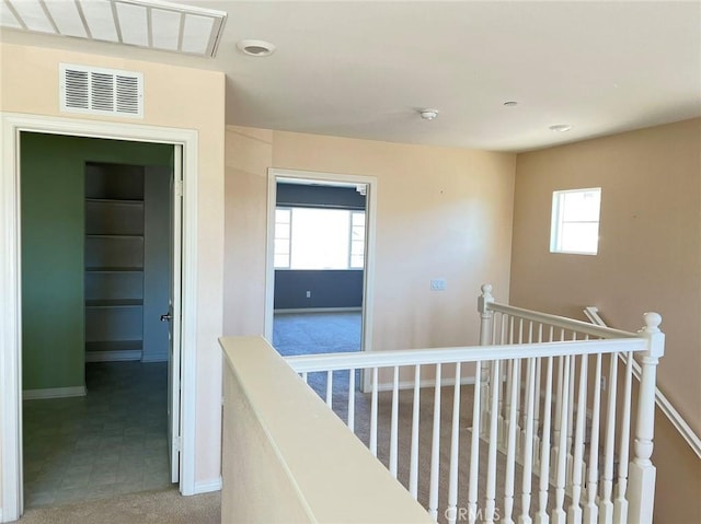 13246 Baxter Springs Dr, Rancho Cucamonga, CA 91739 - hallway with an upstairs landing and baseboards