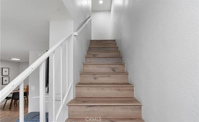 9525 Sylmar Ave Unit 2, Panorama City, CA 91402 - stairway featuring wood finished floors