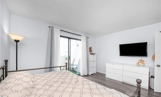 9525 Sylmar Ave Unit 2, Panorama City, CA 91402 - bedroom with wood finished floors and a textured ceiling