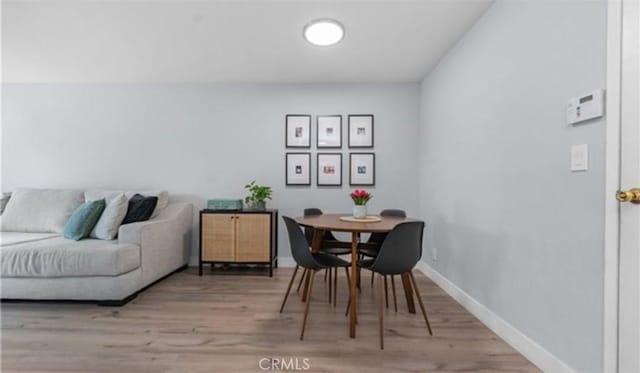 9525 Sylmar Ave Unit 2, Panorama City, CA 91402 - dining area with wood finished floors