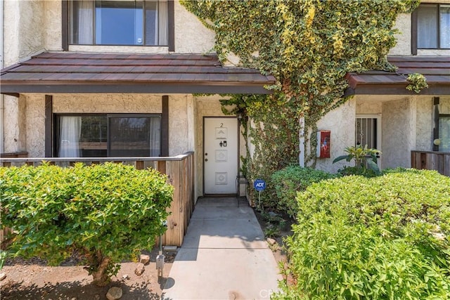 9525 Sylmar Ave Unit 2, Panorama City, CA 91402 - doorway to property with stucco siding and covered porch