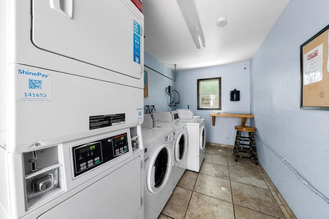 6735 Amherst St Unit 1E, San Diego, CA 92115 - communal laundry room featuring stacked washer / dryer, independent washer and dryer, and light tile patterned floors