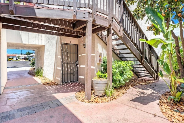 6735 Amherst St Unit 1E, San Diego, CA 92115 - doorway to property featuring stucco siding