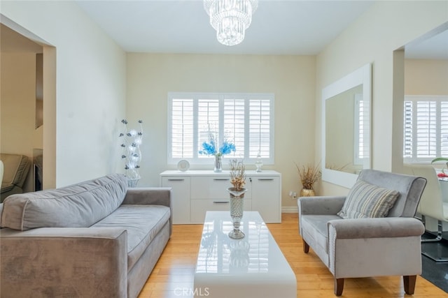15053 Sherman Way Unit A, Van Nuys, CA 91405 - living area with light wood-style floors and a chandelier