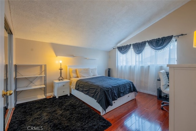 15053 Sherman Way Unit A, Van Nuys, CA 91405 - bedroom featuring lofted ceiling, wood finished floors, and a textured ceiling