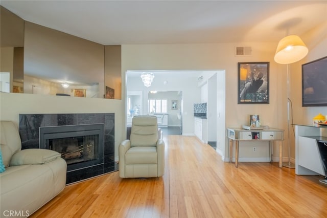 15053 Sherman Way Unit A, Van Nuys, CA 91405 - living area featuring hardwood / wood-style floors and a fireplace