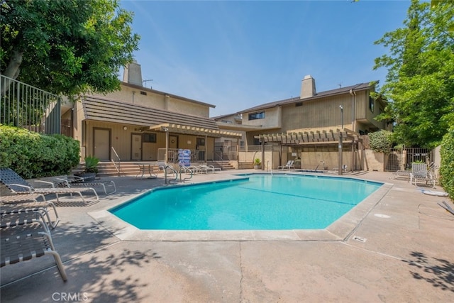 15053 Sherman Way Unit A, Van Nuys, CA 91405 - community pool featuring a patio area and a pergola