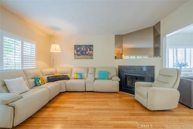 15053 Sherman Way Unit A, Van Nuys, CA 91405 - living area with light wood finished floors and a fireplace