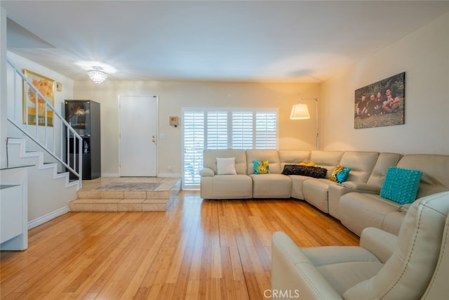 15053 Sherman Way Unit A, Van Nuys, CA 91405 - living area featuring stairway and light wood-style floors