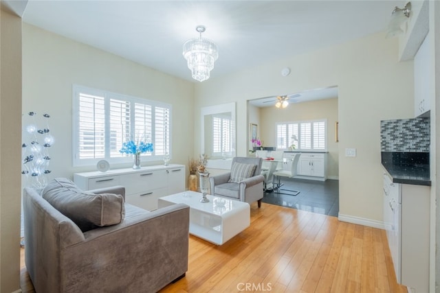 15053 Sherman Way Unit A, Van Nuys, CA 91405 - living area with a chandelier, light wood-type flooring, and a ceiling fan