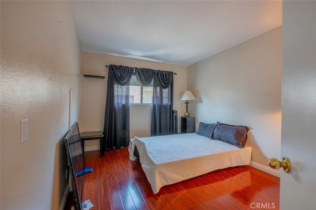 15053 Sherman Way Unit A, Van Nuys, CA 91405 - bedroom featuring wood finished floors and baseboards