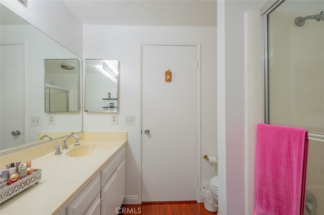 15053 Sherman Way Unit A, Van Nuys, CA 91405 - bathroom with vanity, a shower with shower door, and wood finished floors
