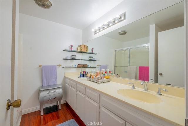 15053 Sherman Way Unit A, Van Nuys, CA 91405 - full bath featuring wood finished floors, a shower stall, and vanity