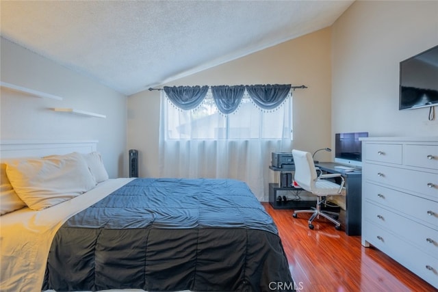 15053 Sherman Way Unit A, Van Nuys, CA 91405 - bedroom featuring vaulted ceiling, wood finished floors, and a textured ceiling