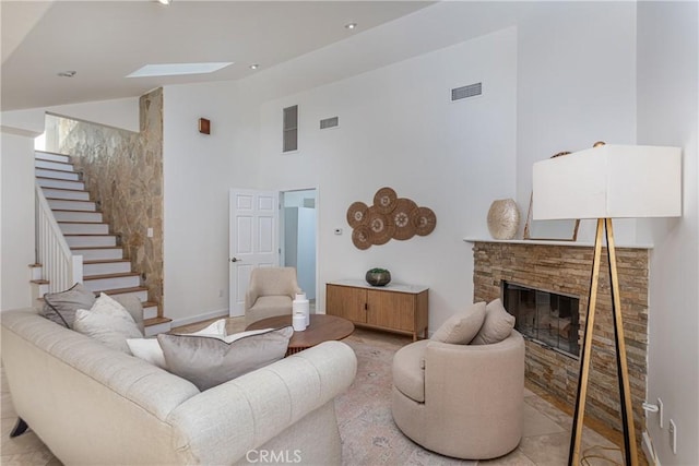 624 S Reese Pl, Burbank, CA 91506 - living area with high vaulted ceiling, a stone fireplace, and stairs