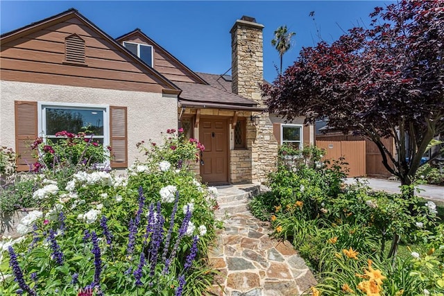 624 S Reese Pl, Burbank, CA 91506 - view of front of property featuring a chimney, stucco siding, stone siding, and a shingled roof