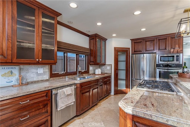 624 S Reese Pl, Burbank, CA 91506 - kitchen featuring appliances with stainless steel finishes, recessed lighting, tasteful backsplash, light stone countertops, and light tile patterned flooring