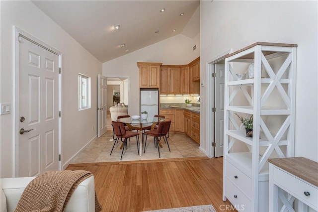 624 S Reese Pl, Burbank, CA 91506 - dining room featuring high vaulted ceiling and light wood-type flooring