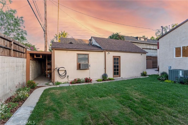 624 S Reese Pl, Burbank, CA 91506 - back of house with stucco siding, a shingled roof, and cooling unit