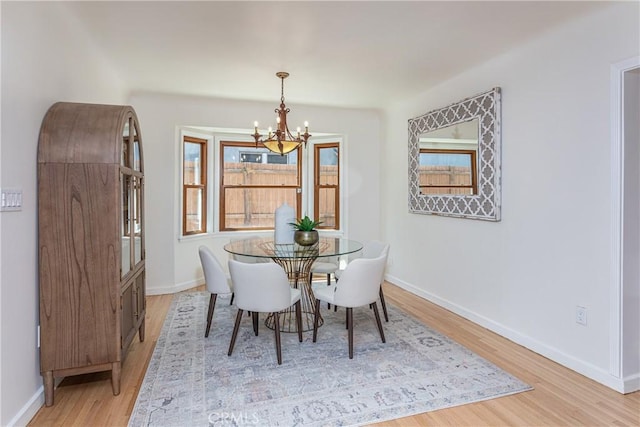 624 S Reese Pl, Burbank, CA 91506 - dining room with a chandelier, light wood-type flooring, and plenty of natural light