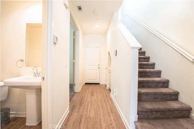 12893 Breccia Way, Moreno Valley, CA 92555 - stairs with wood finished floors and baseboards