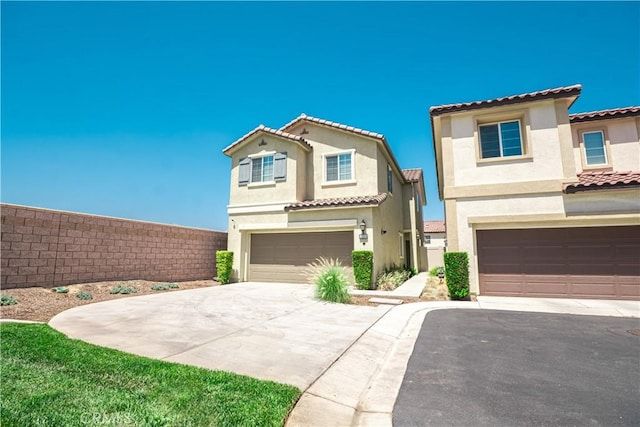 12893 Breccia Way, Moreno Valley, CA 92555 - view of front of property with a garage, stucco siding, a tiled roof, and driveway