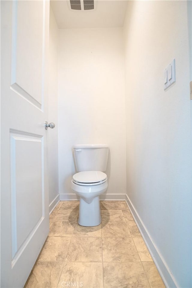 12893 Breccia Way, Moreno Valley, CA 92555 - bathroom featuring baseboards and toilet