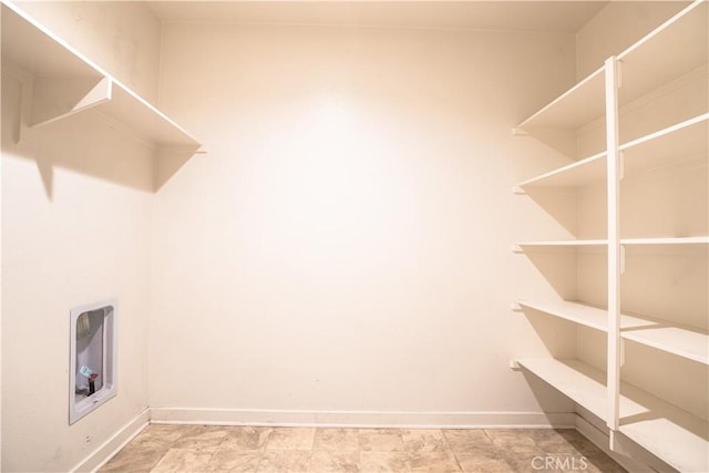 12893 Breccia Way, Moreno Valley, CA 92555 - laundry room featuring washer hookup and baseboards