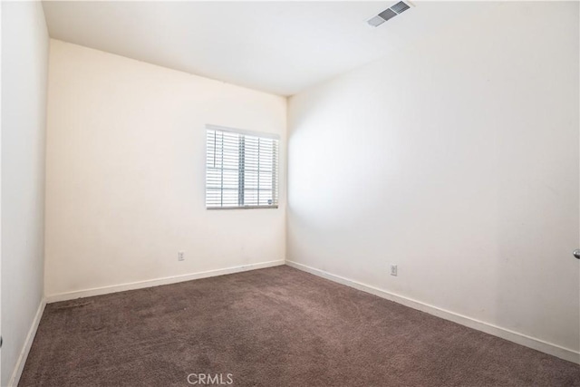 12893 Breccia Way, Moreno Valley, CA 92555 - empty room featuring dark carpet